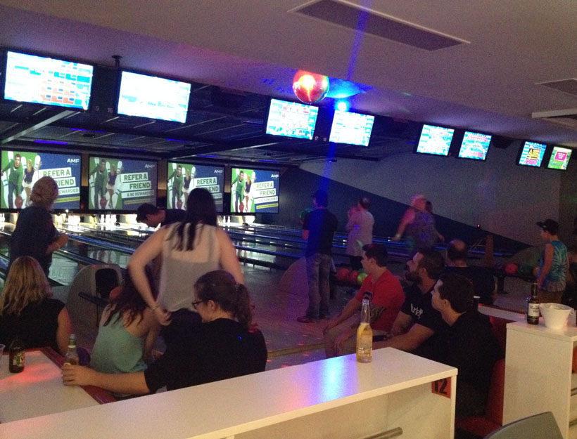 People gathering around and bowling